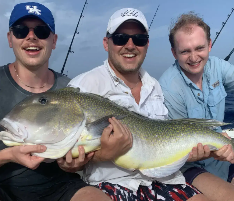 Anglers showing trophy grouper catch on a Florida Keys fishing charter